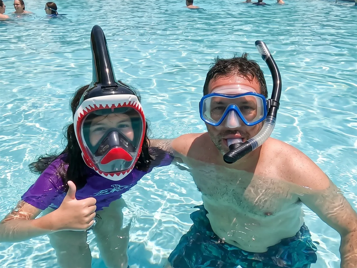 Family swimming together with NEBIBO